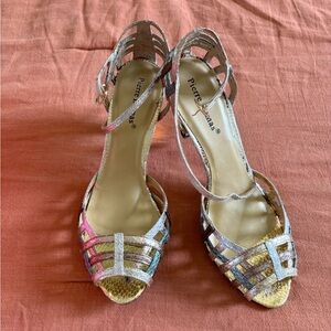 Strappy mixed metallic Pierre Dumas heels.